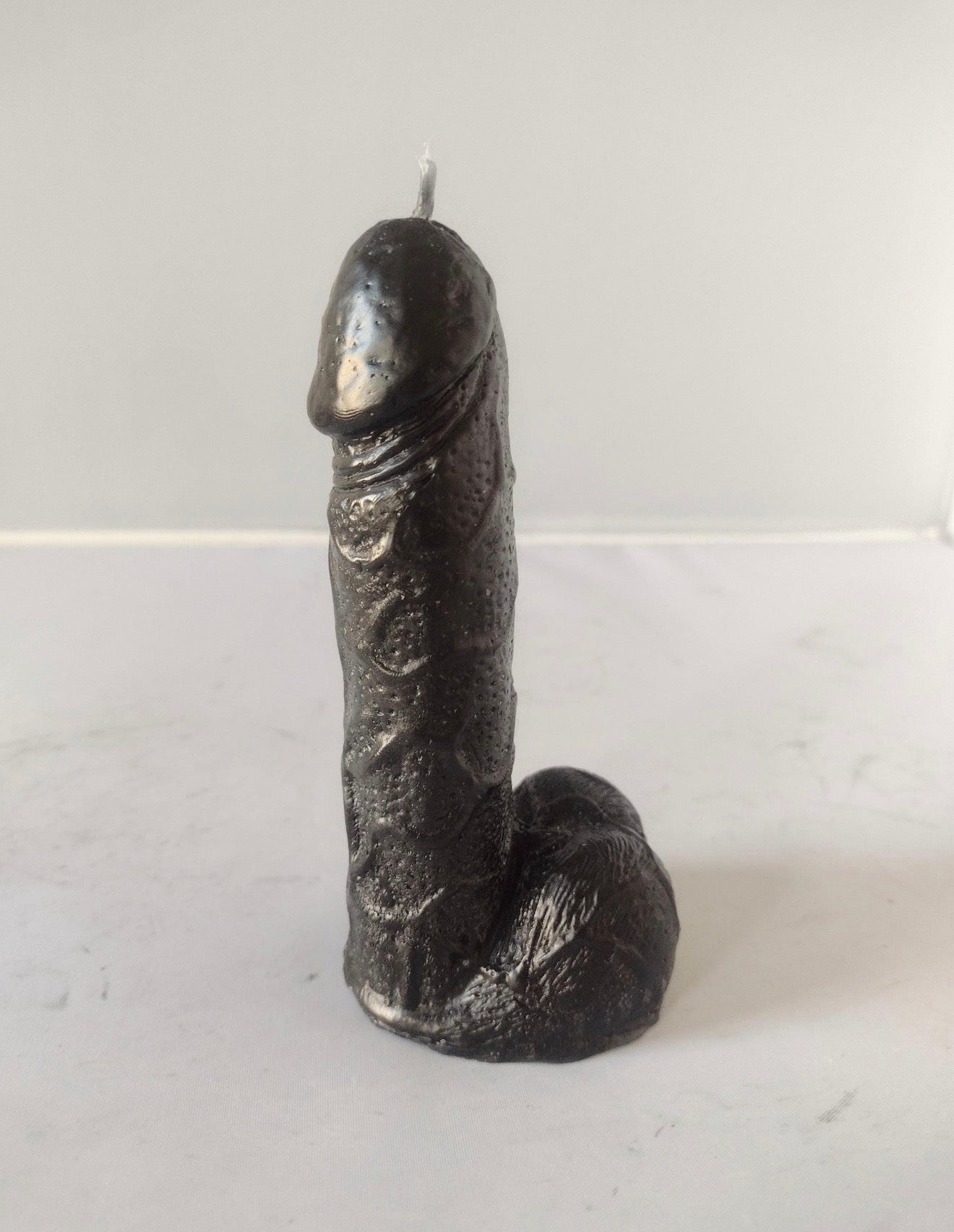 Black willy joke candle