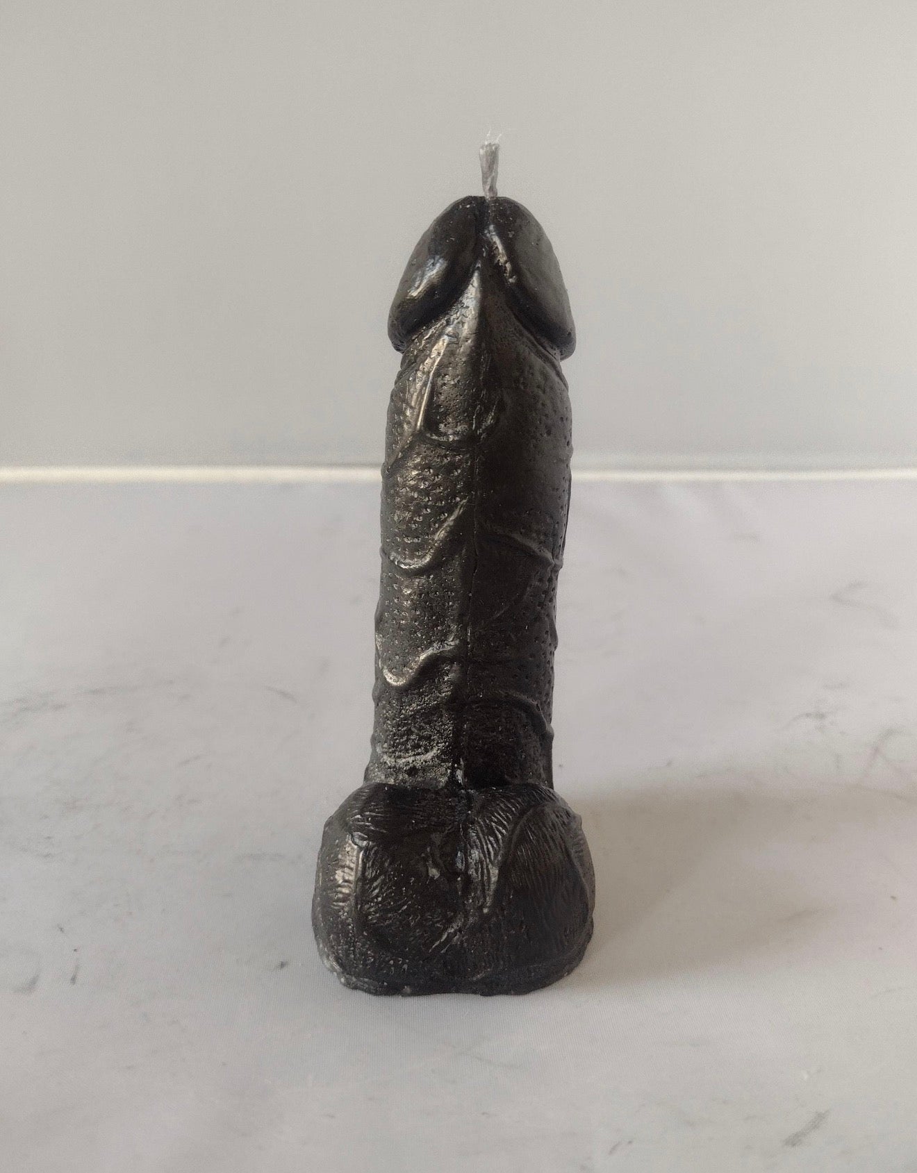 Black willy joke candle